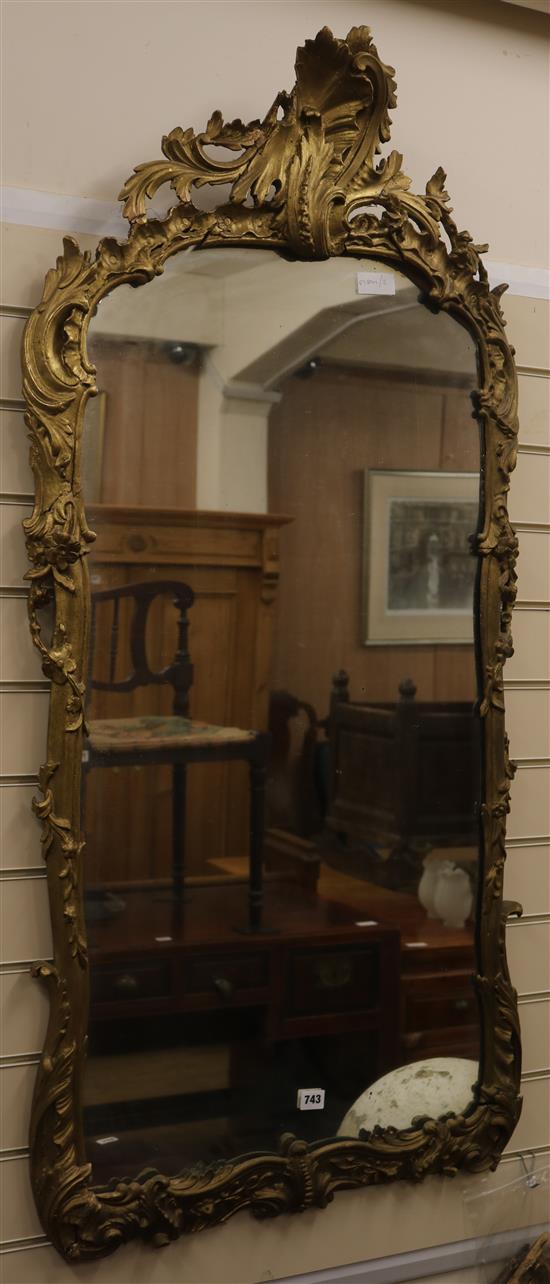 An 18th style gilt painted carved wood and gesso mirror, H.136cm